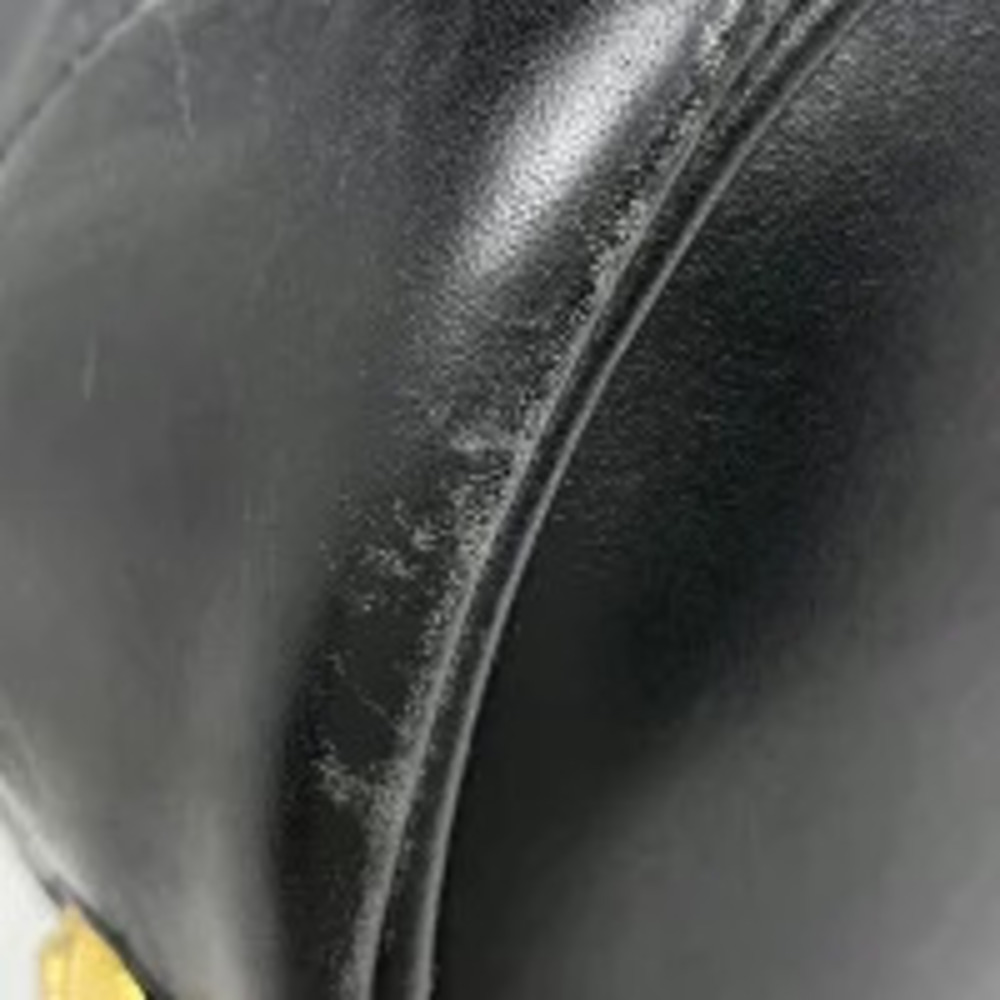 Salvatore Ferragamo drawstring shoulder leather motif pump bag black